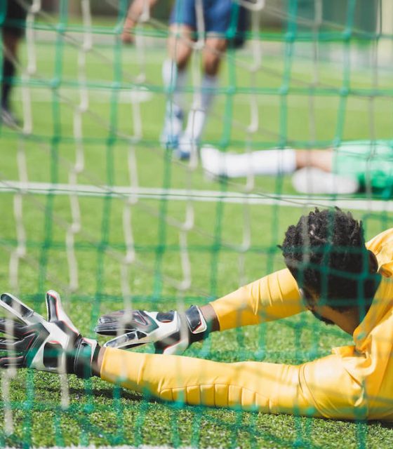 back-view-of-goalkeeper-catching-ball-during-socce-2021-08-29-11-18-39-utc-1.jpg